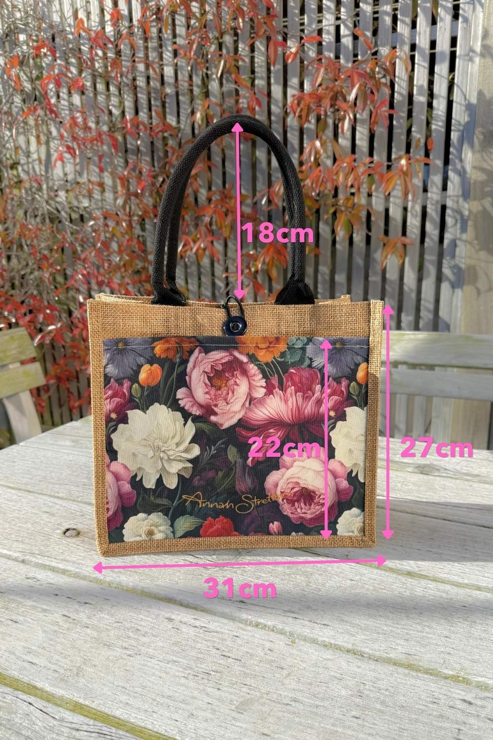 Close up of the blue floral pocket design on the mini jute bag