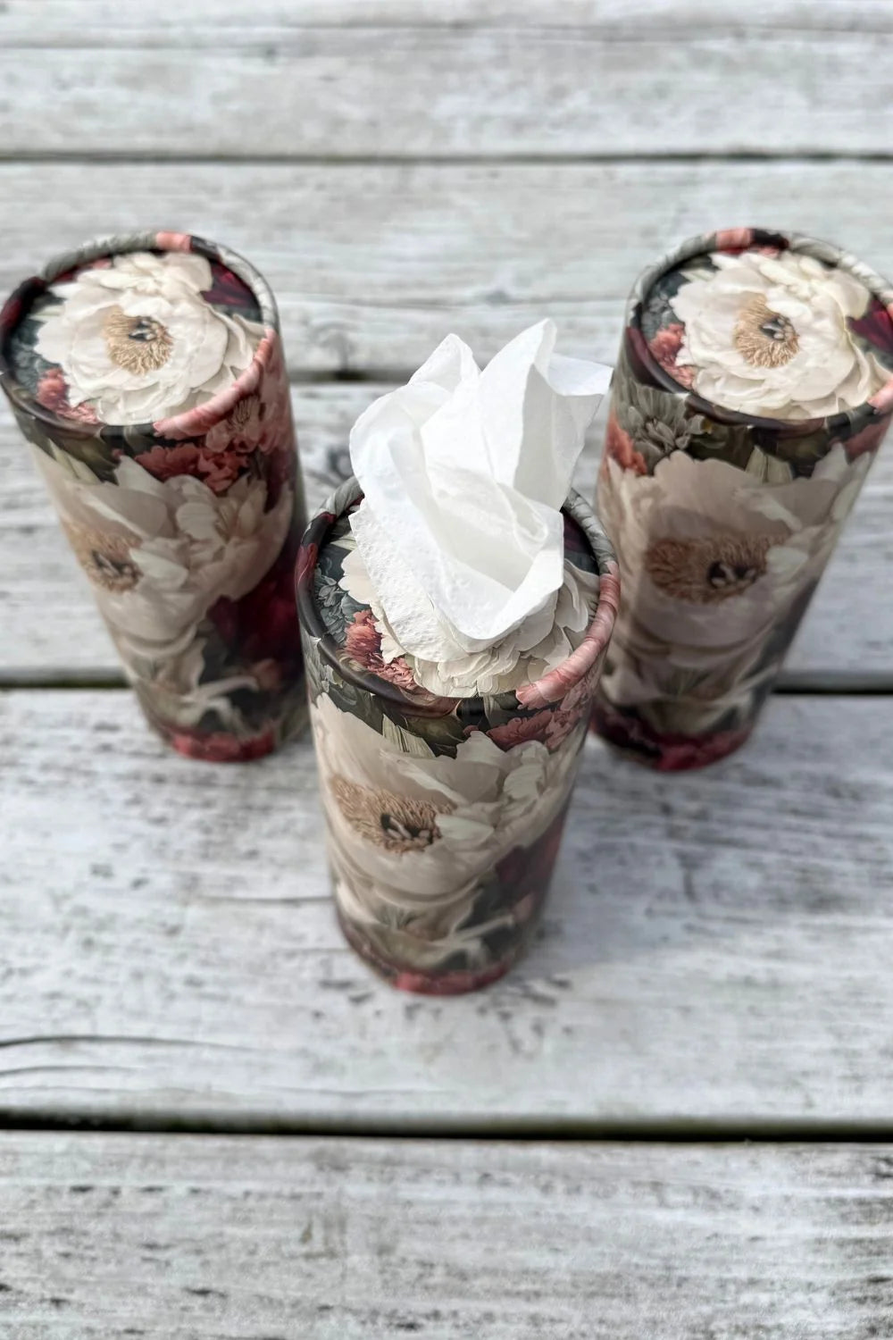 Close-up of the Adorable floral tissue cylinder showing a tissue drawn from the top