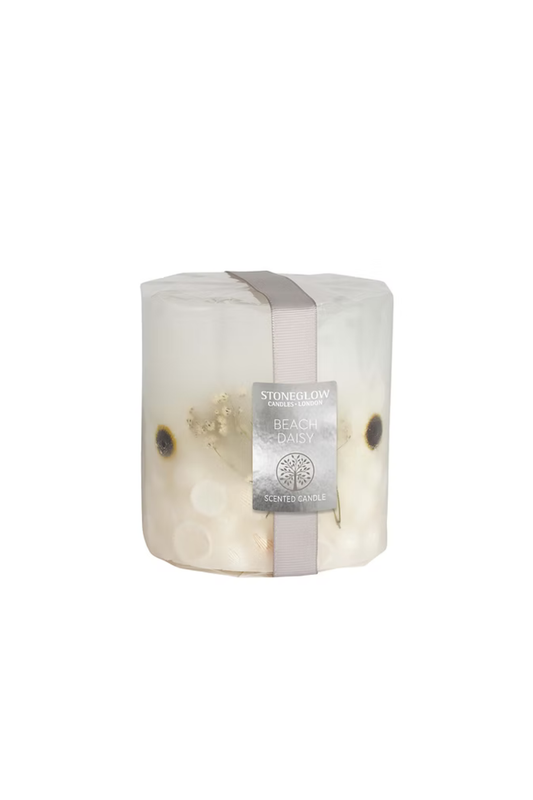 Candle with floral decoration with a label on a white background