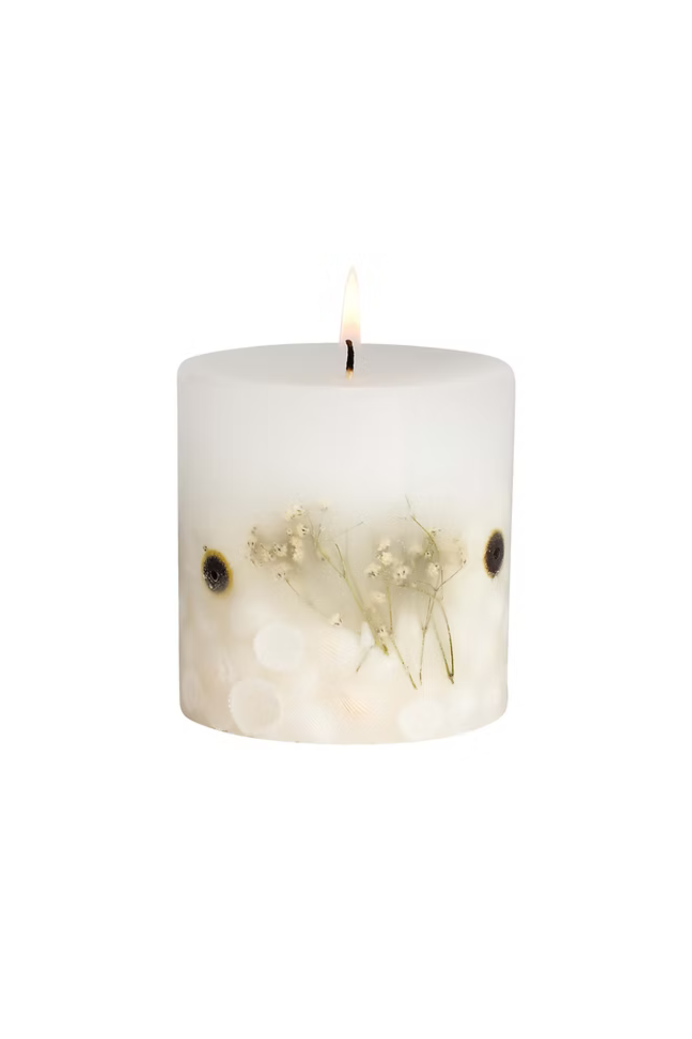 White candle with floral design on a white background